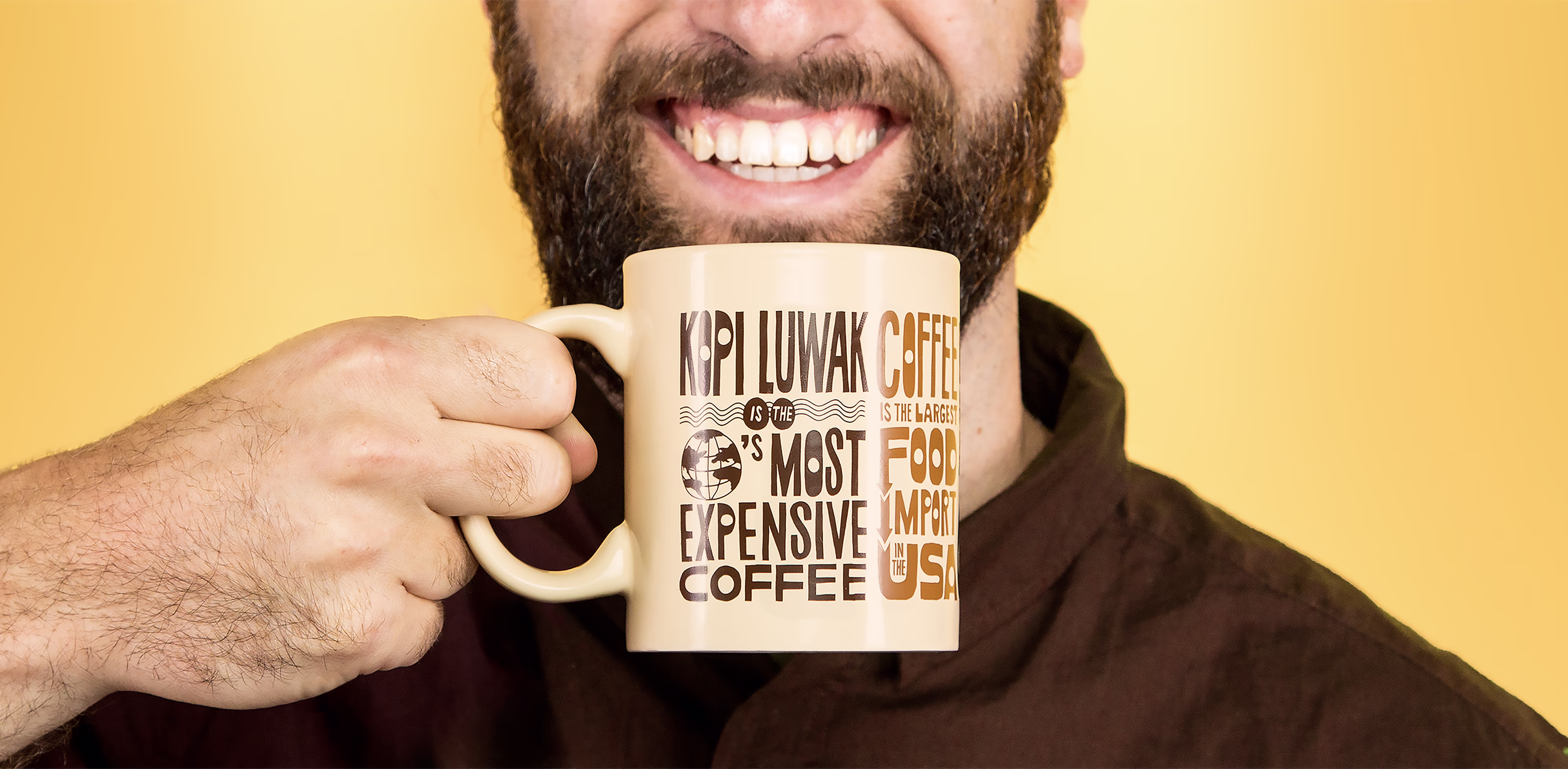 Man holding a Keurig Mug with coffee facts